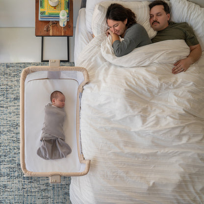 HALO 2-in-1 Bedside BassiNest Sleeper next to bed